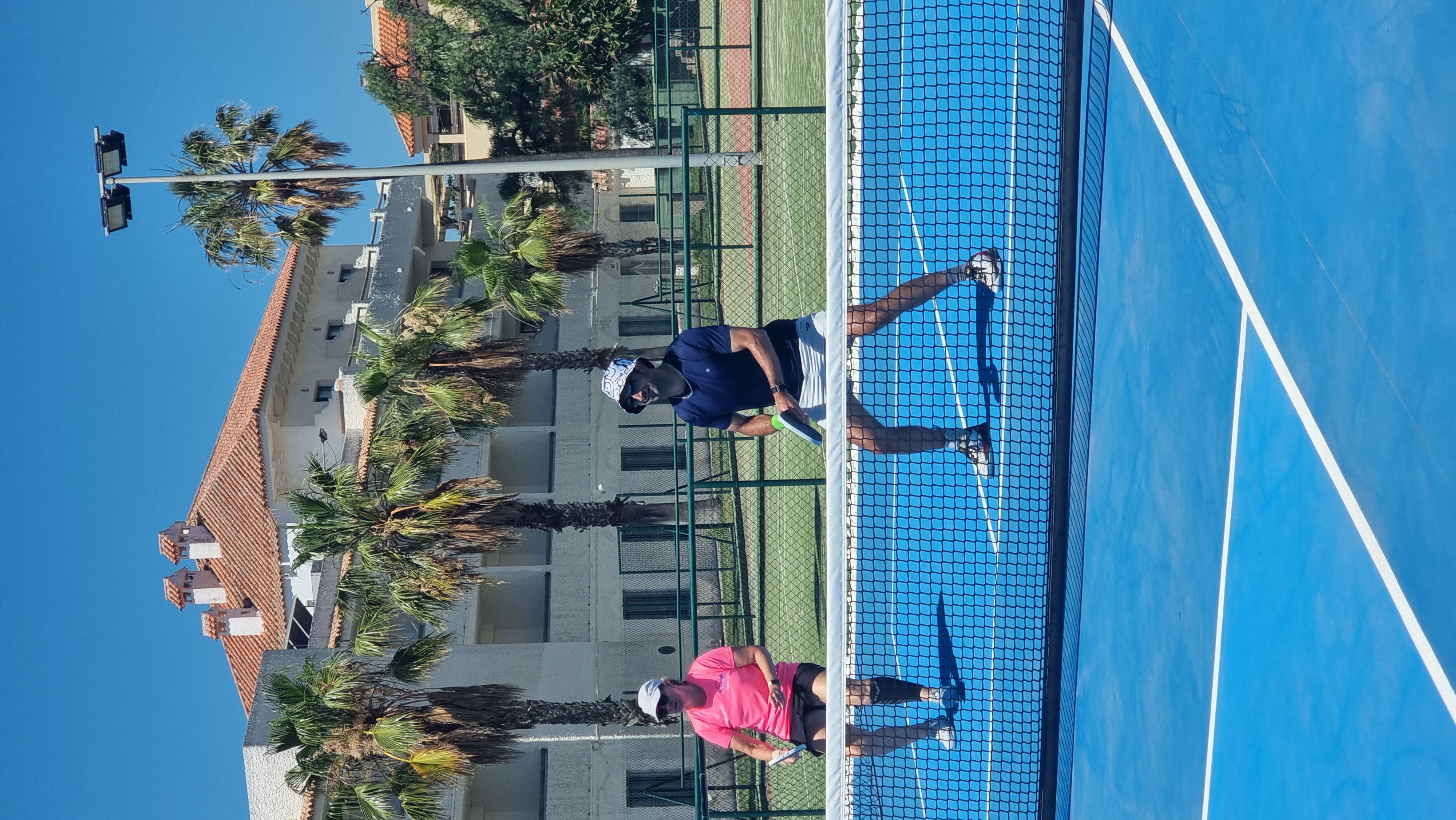 Louise playing pickleball with pro player James Chaudry at Hotel Playa de la Luz